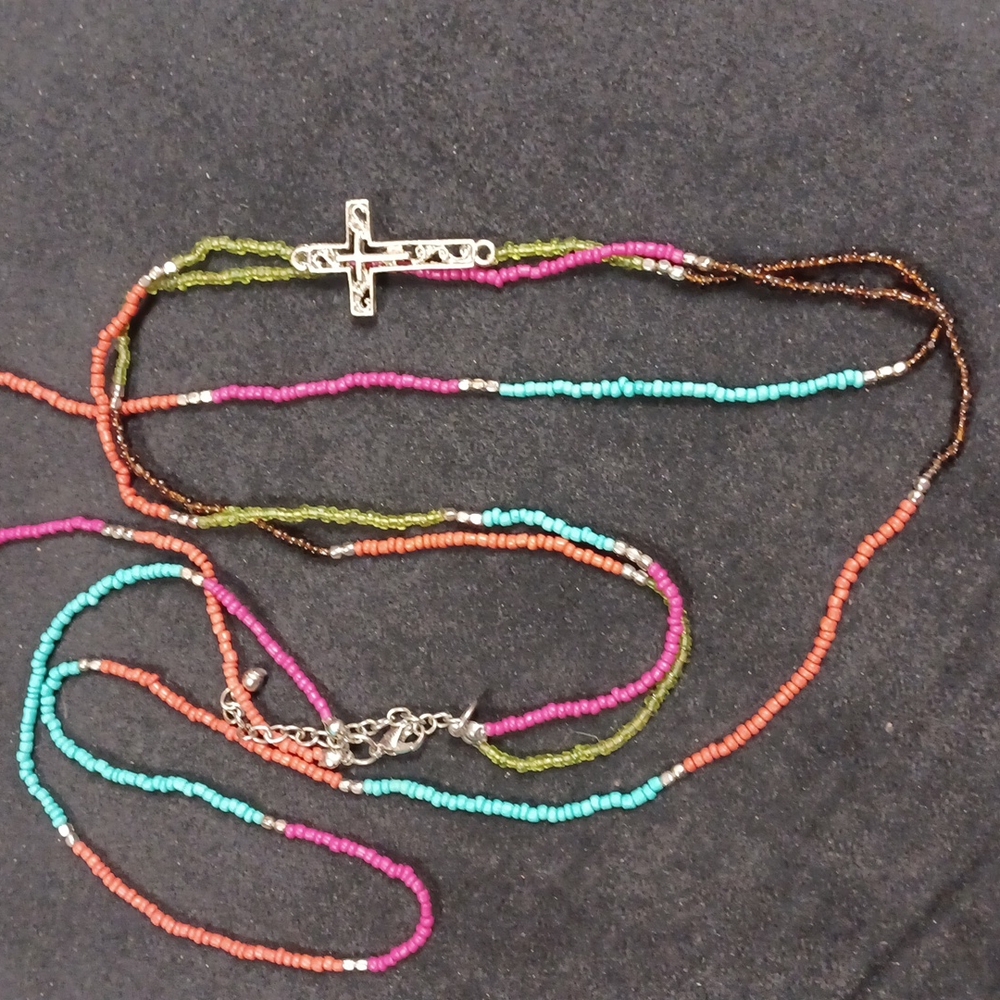 Multi layered/ colored necklace with boho touch and cross focal point